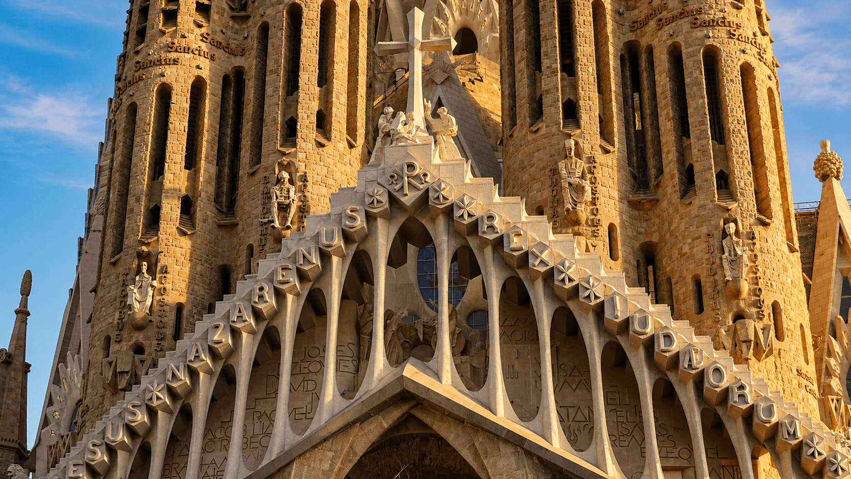 Sunlight pouring through stained glass and tree-like columns inside the Sagrada Familia basilica